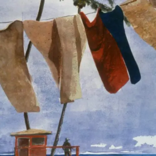 A Lifeguard Dries His Towels